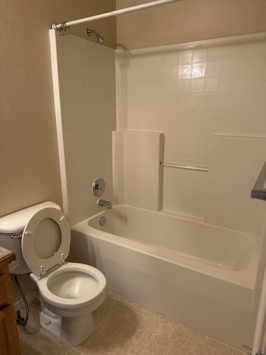 A cleaned bathroom tub, surround and toilet