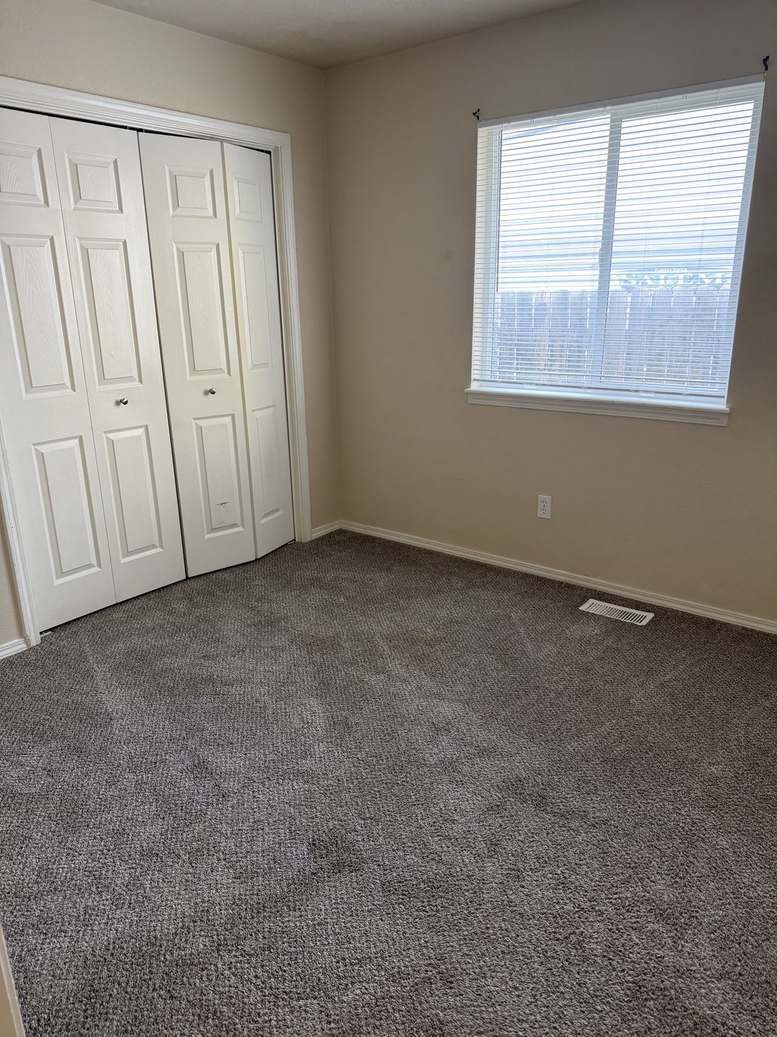 Cleaned bedroom carpet in a finished apartment unit